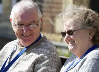 Man and woman sitting outside