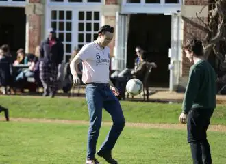 Two people playing football