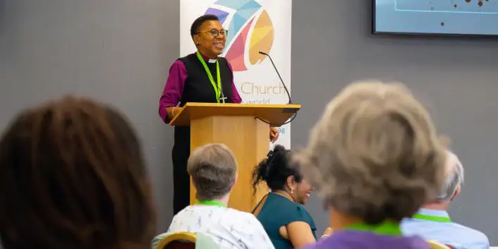 A person speaking at a lectern