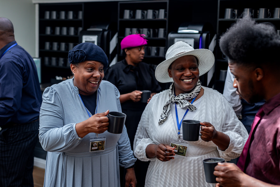 Two women enjoying coffee at one of our conference venues.
