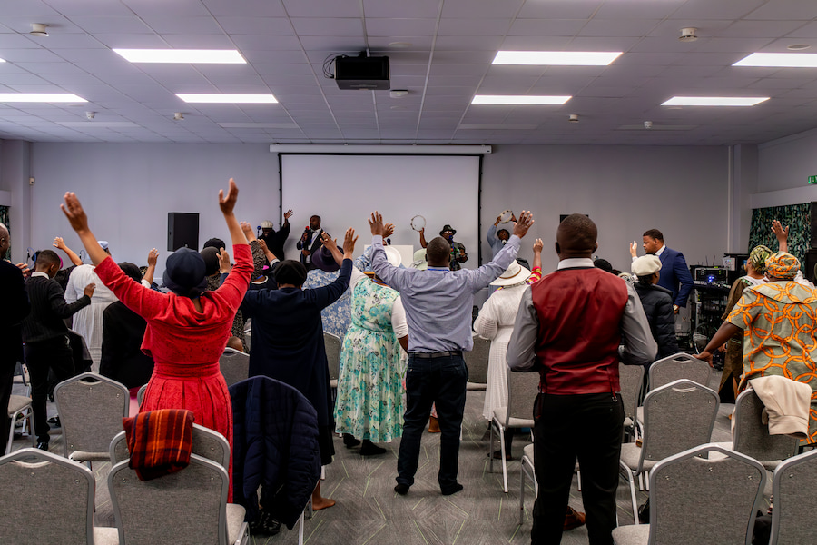 Guests worshipping together at Highgate House.