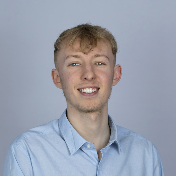 Jamie smiling at the camera.