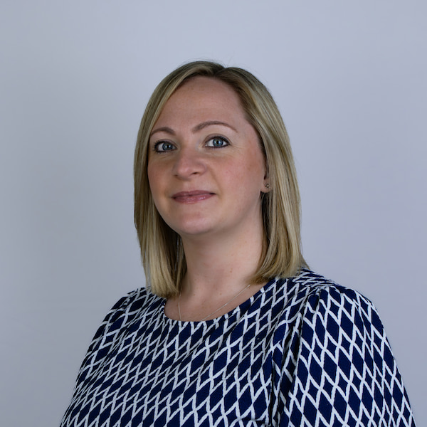 Laura smiling at the camera.