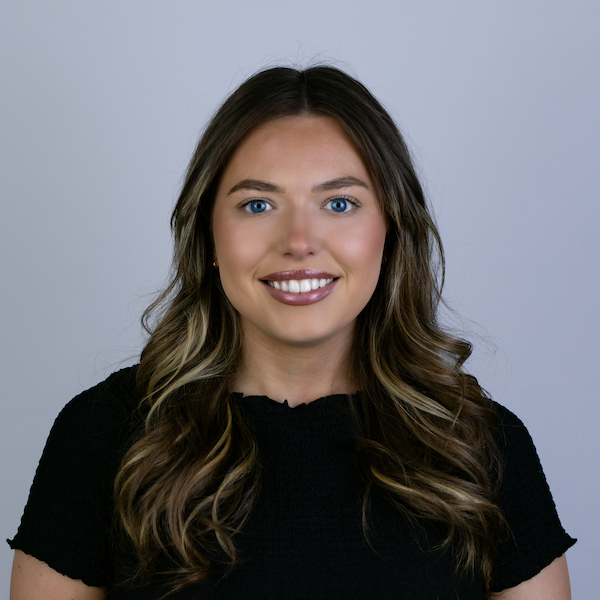 Remi smiling at the camera.