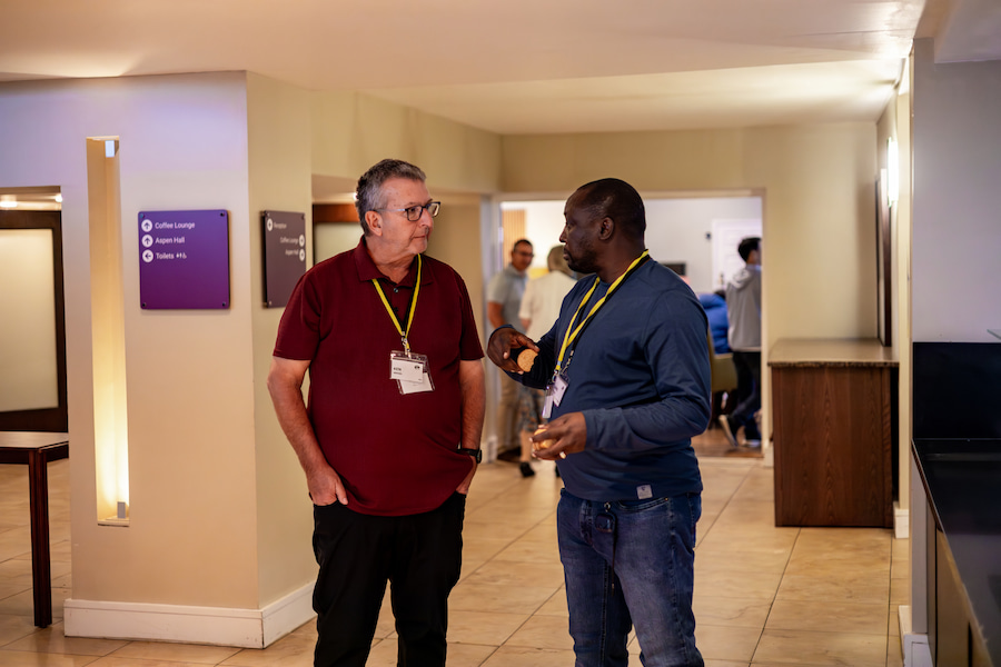 2 Board members talking during their coffee break at Highgate House.