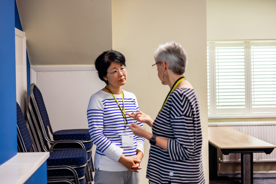 2 Board members chatting at Highgate House.