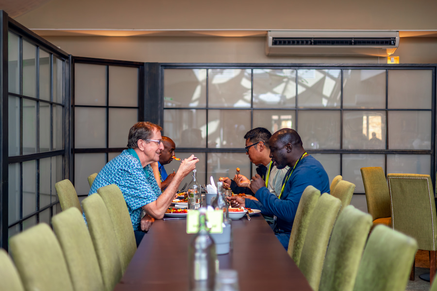 Some Board members eating together at Highgate House.