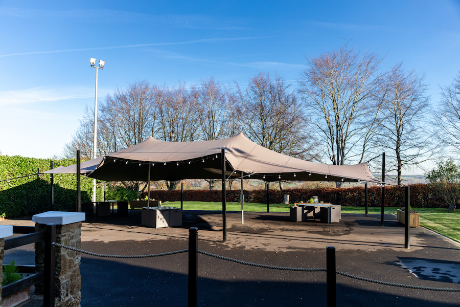 The stretch tent on a sunny winter's day with blue sky overlooking the Northamptonshire country side.