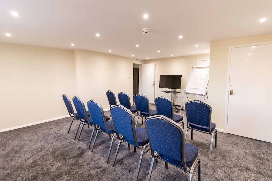 The anteroom of Ismay with new LED lights, new carpet, and a tv.
