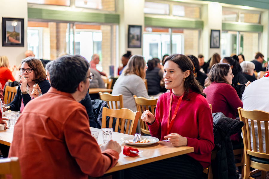 An image of a man and woman deep in conversation during lunch.