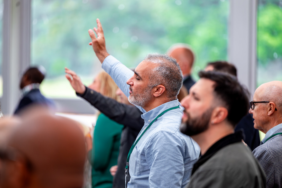 People worshipping during an event at High Leigh conference centre in Hertfordshire.