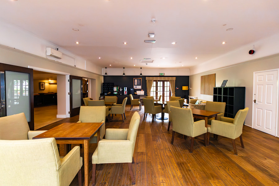 The coffee lounge showing the seating and sofa's with cosy lighting.