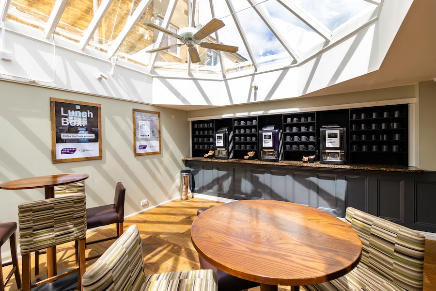The coffee lounge showing the Paddy & Scott's coffee machines and the conservatory ceiling.