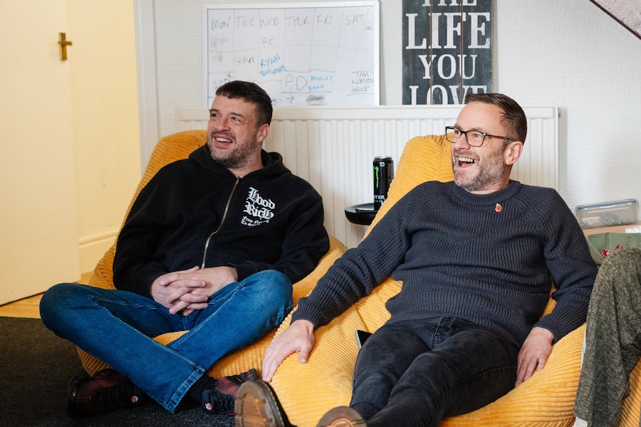 2 guys laughing together.
