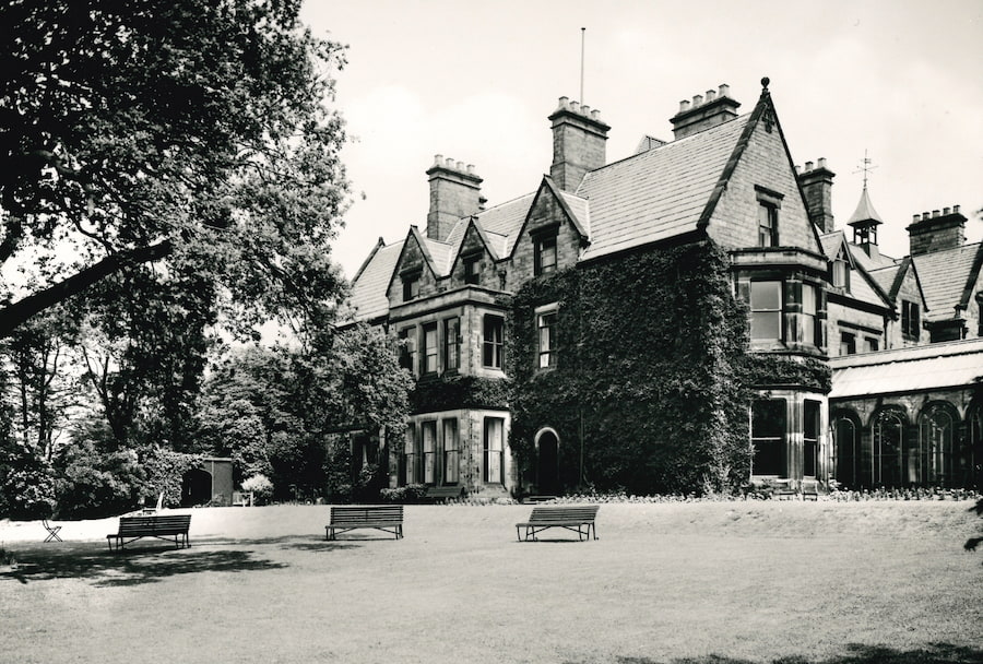 The Hayes main house building in the 30s and instead of firepits, there are benches.