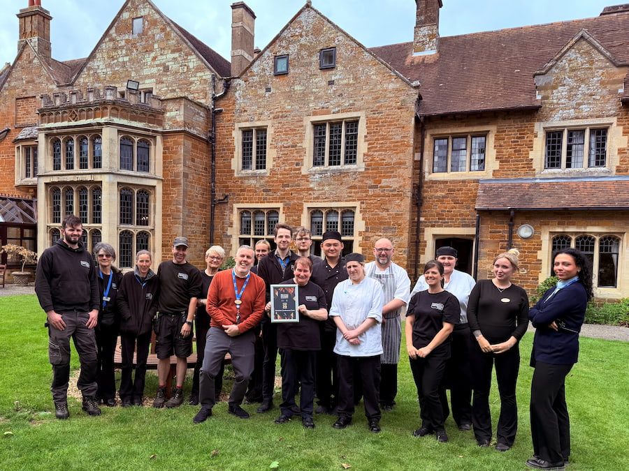 Some of the team at Highgate House celebrating outside the front of Highgate House.