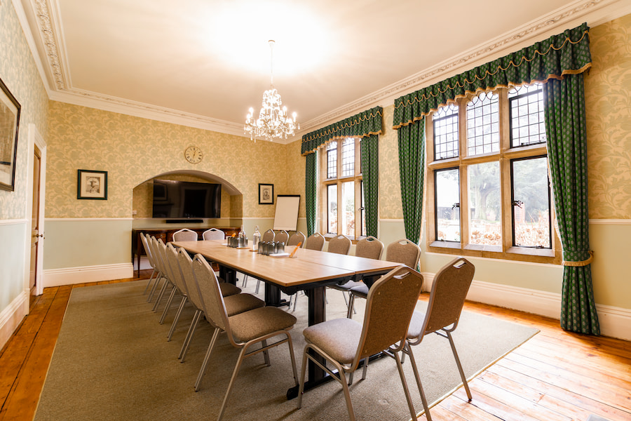 Holly set out in boardroom style showing the flat screen TV.