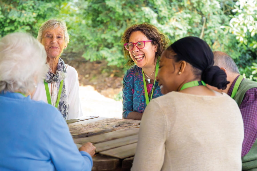 A group at a table laughing.