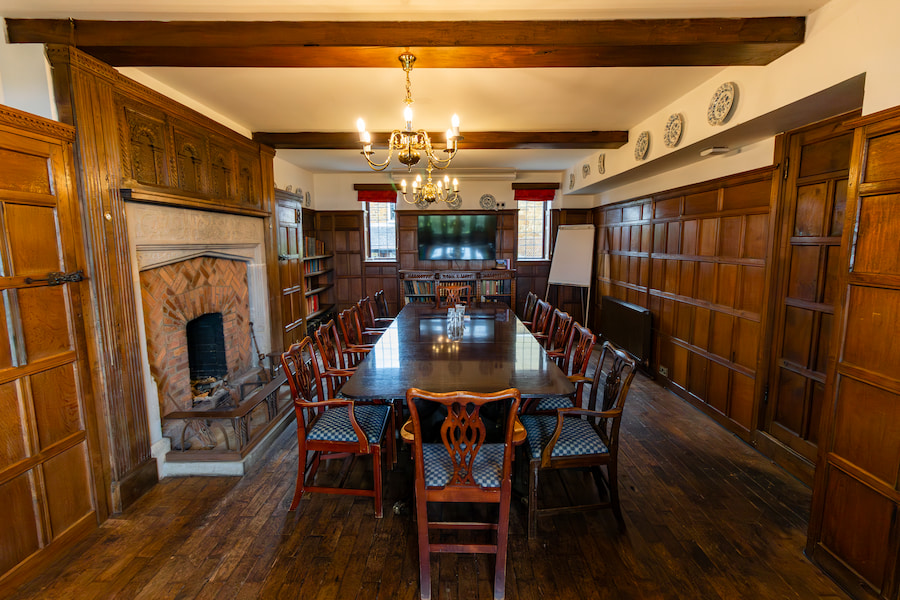 Library with it's 55 inch tv at the end of the table on the wall.
