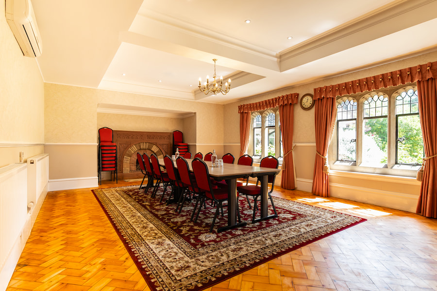 Pine set out in boardroom style with sun streaming through the windows.